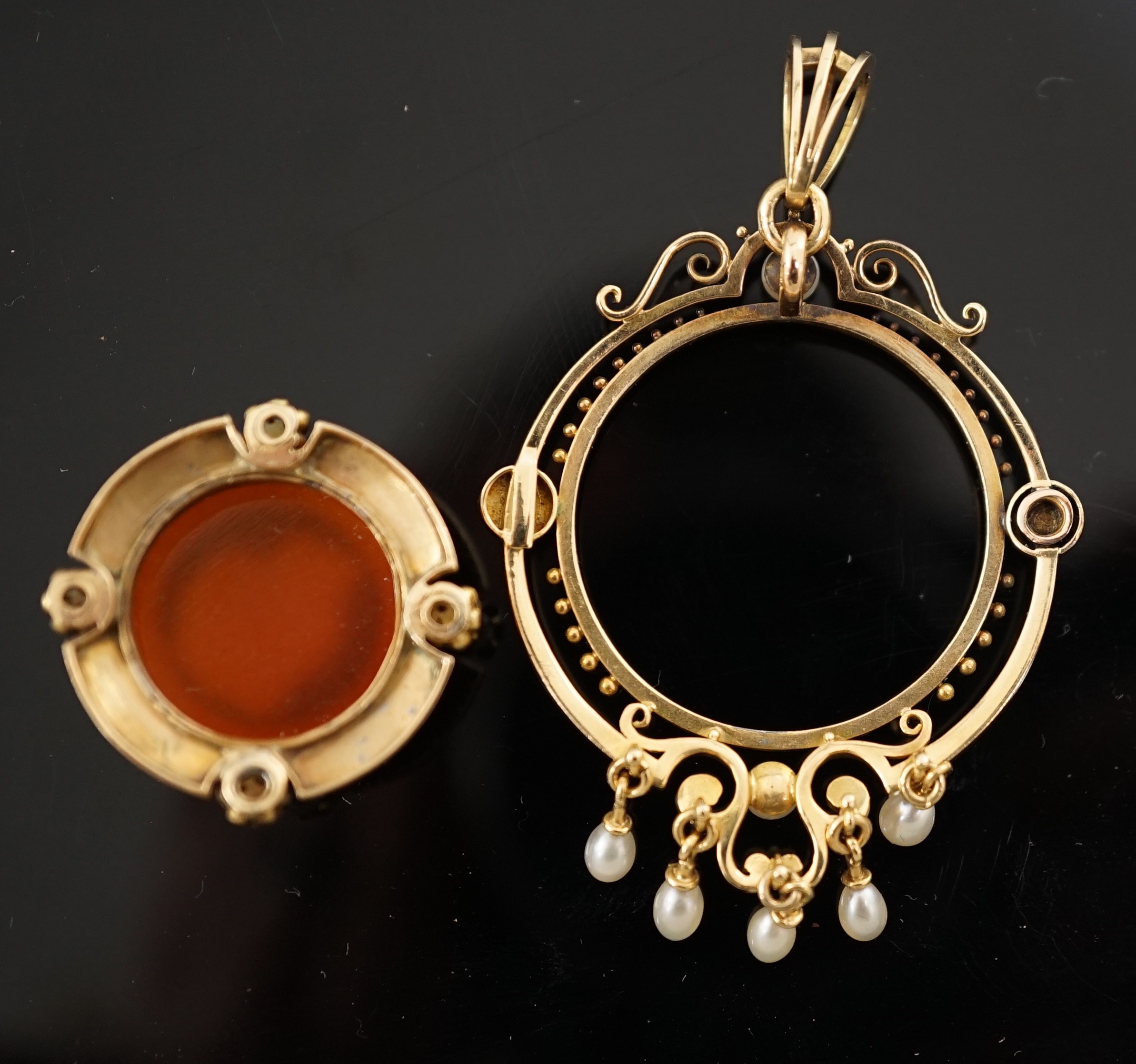 A Victorian gold, pearl, black enamel, and sardonyx hardstone cameo set drop pendant